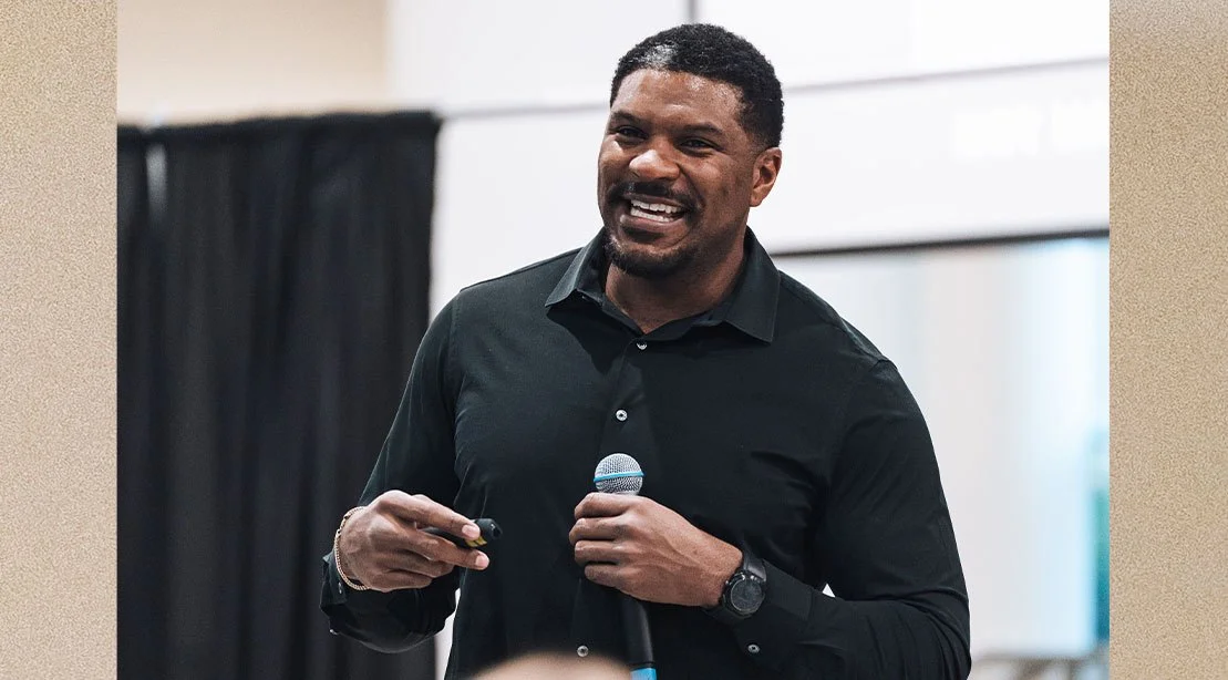 Julius Thomas smiling at a speaking event