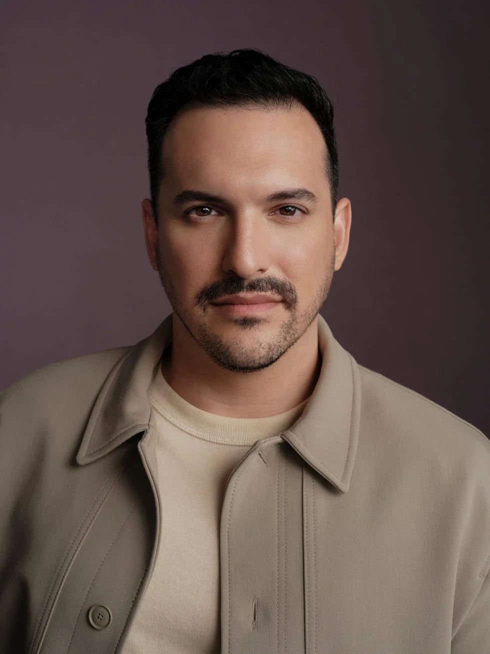 portrait of a person wearing a neutraltoned jacket