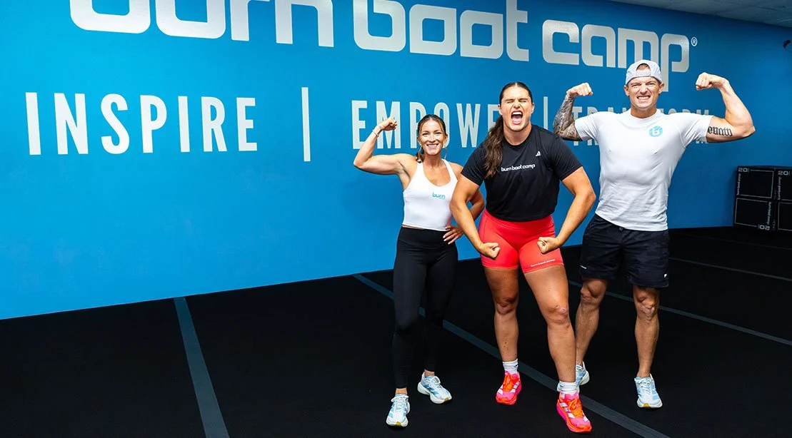 Ilana Maher power posing in her bootcamp gym